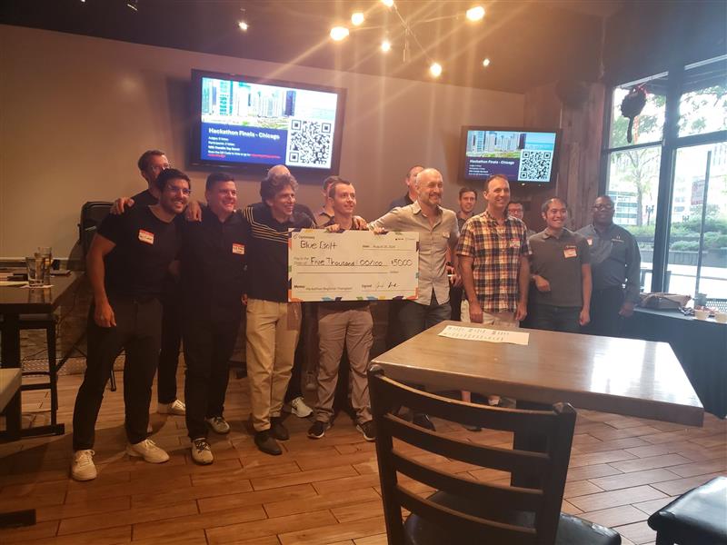 The winning team for Chicago, Optimizely SaaS CMS hackathon 2024, holding giant check.