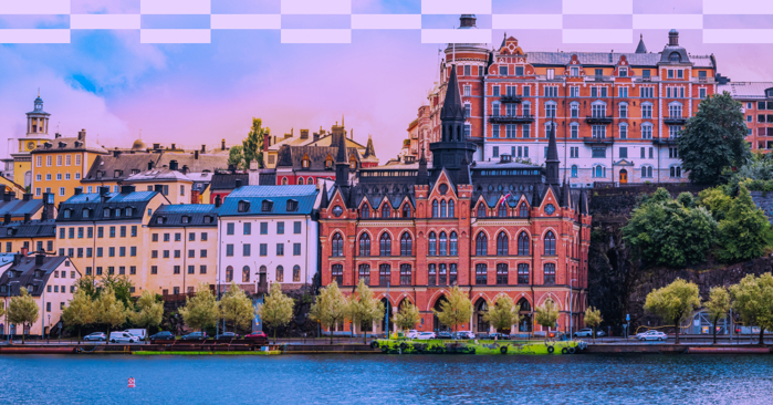 a large building with a body of water in front of it